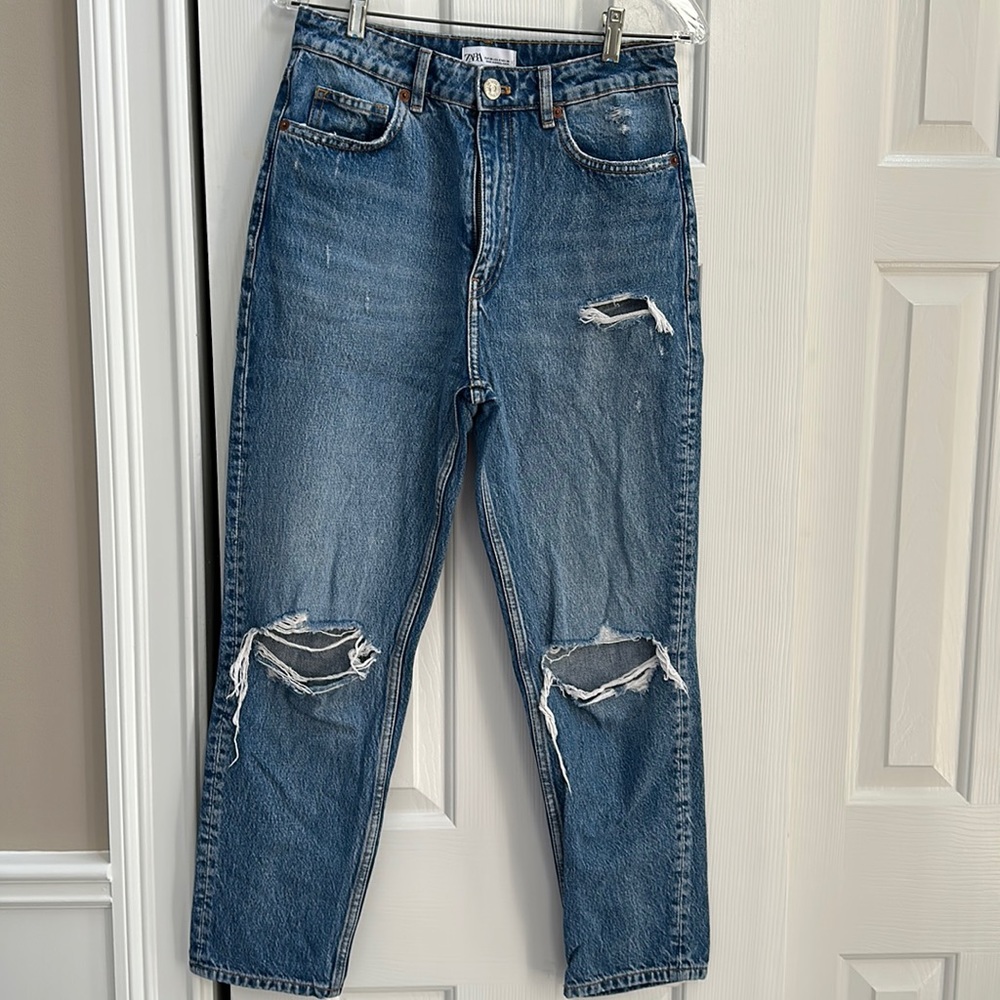 Ladies distressed boyfriend jeans.